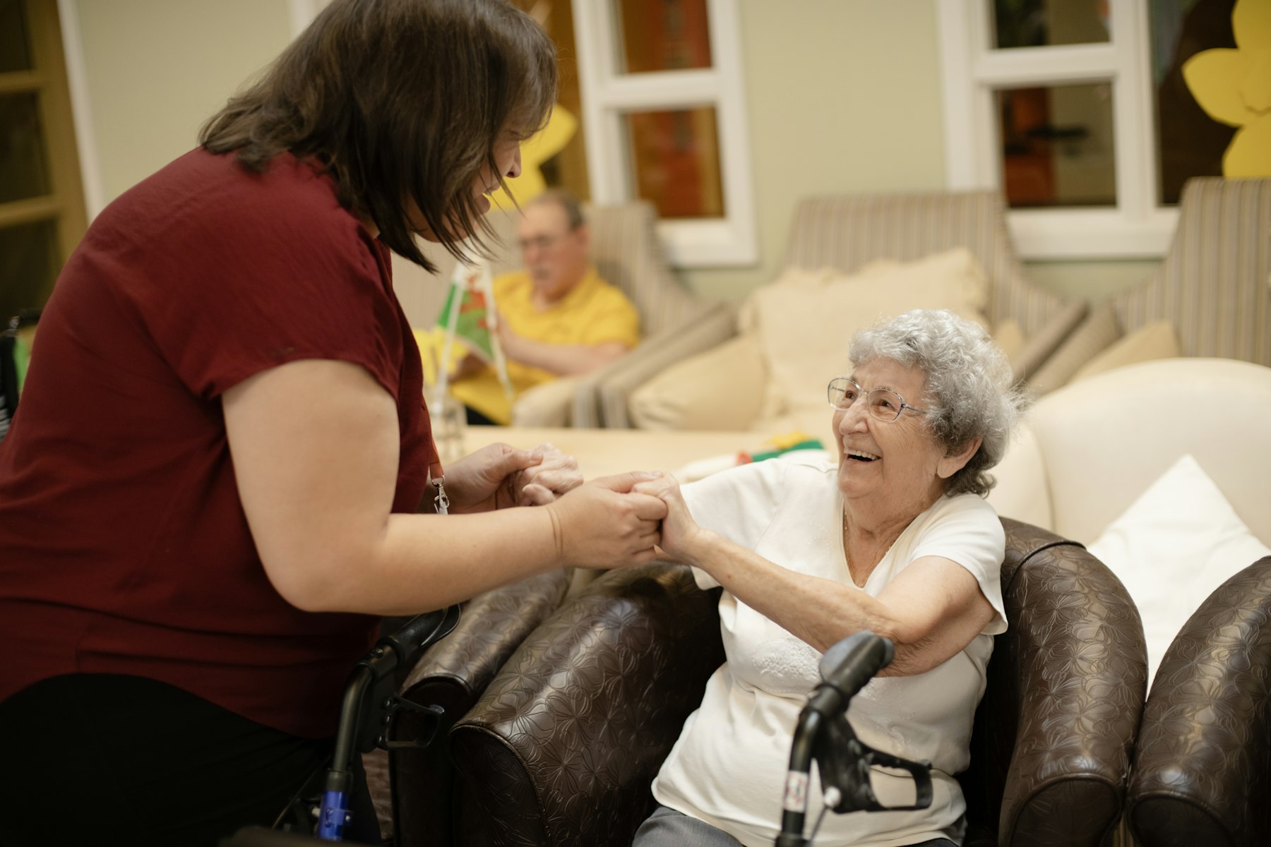 Support worker sitting and chatting with a client
