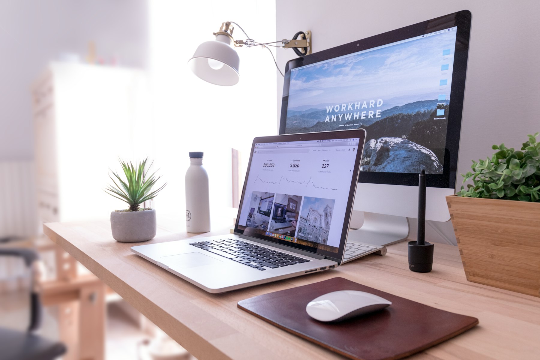 Tidy desk with a computer set up for web design work