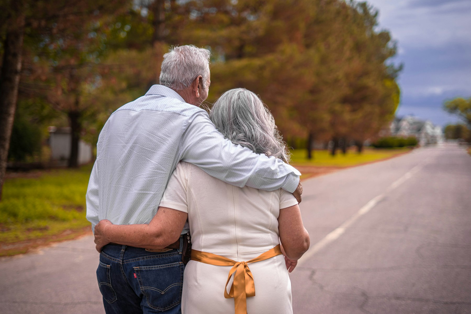 Older couple walking together near the coast