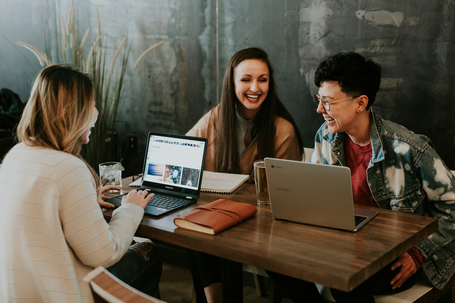 Small team reviewing a website on a laptop