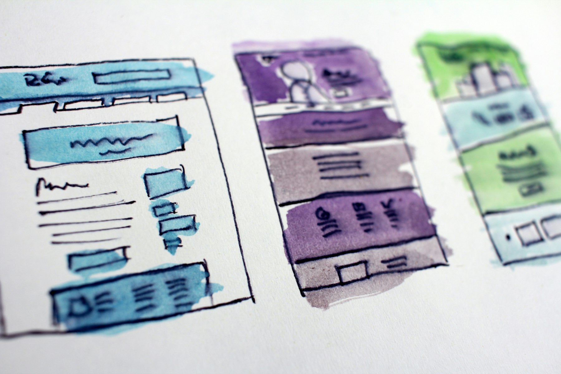 Website layouts sketched on paper